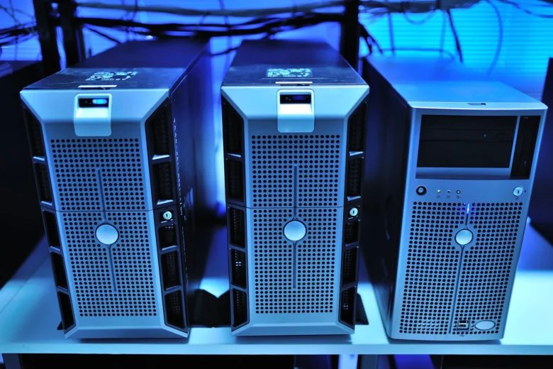 Rows of GPU servers in a data center rack, representing high-throughput inference infrastructure for serving large language models.
