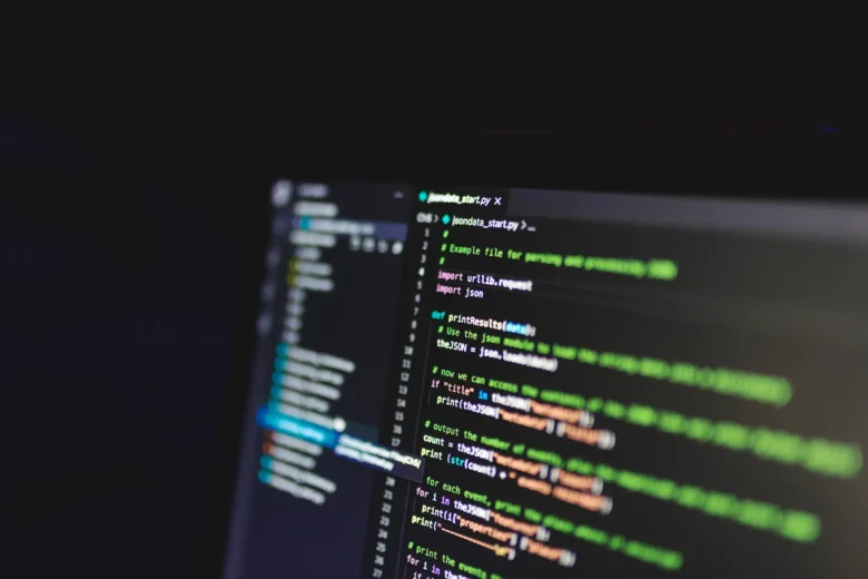 Two engineer workstations displaying JSON schema definitions and API response validation logs side by side
