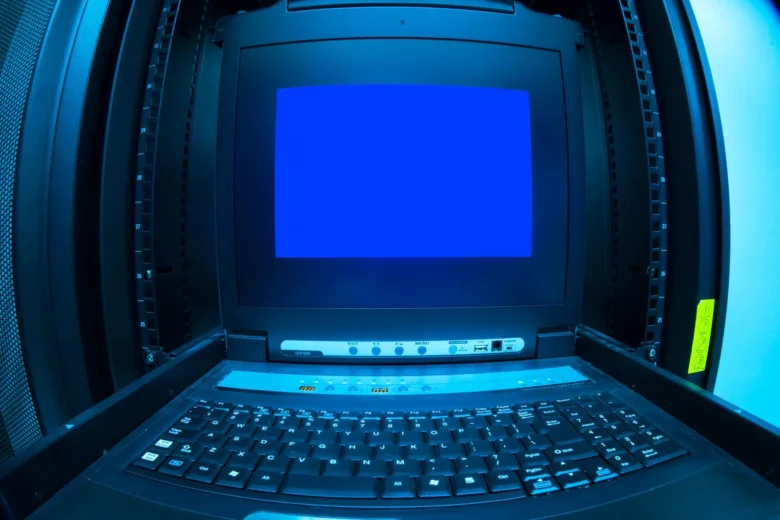 Rows of servers inside a modern cloud data center with blue status lights