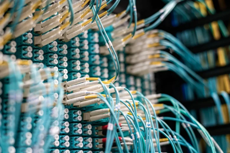 Rows of illuminated server racks processing cloud AI workloads in a European data center
