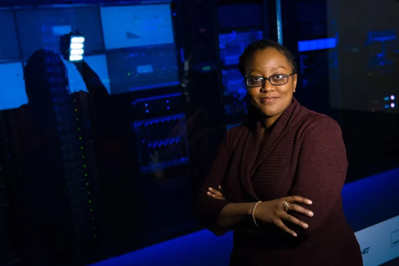 Rows of cloud computing servers in a data center representing metered AI infrastructure costs