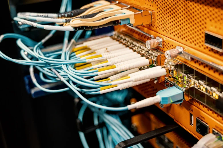 Rows of GPU servers racked in a cloud data center running AI inference workloads