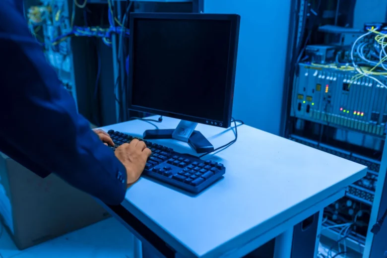 Engineer reviewing LLM tracing dashboards on monitoring screens in a data center