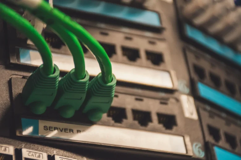 Rows of illuminated GPU servers in a data center rack reserved for machine learning workloads