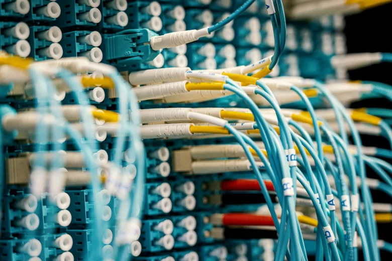 Rows of GPU servers with network cabling in a data center, representing LLM inference latency stages