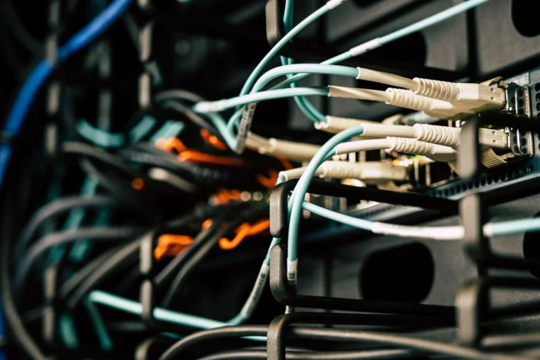 Close-up of a padlock on a server rack in a data center, representing credential rotation for cloud AI APIs.