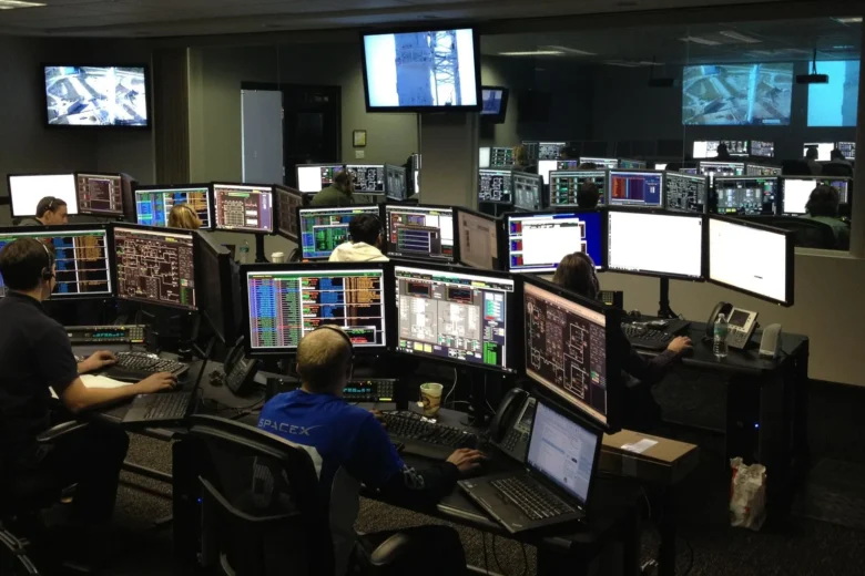 Engineer watching rate limit and token utilisation dashboards for an AI gateway